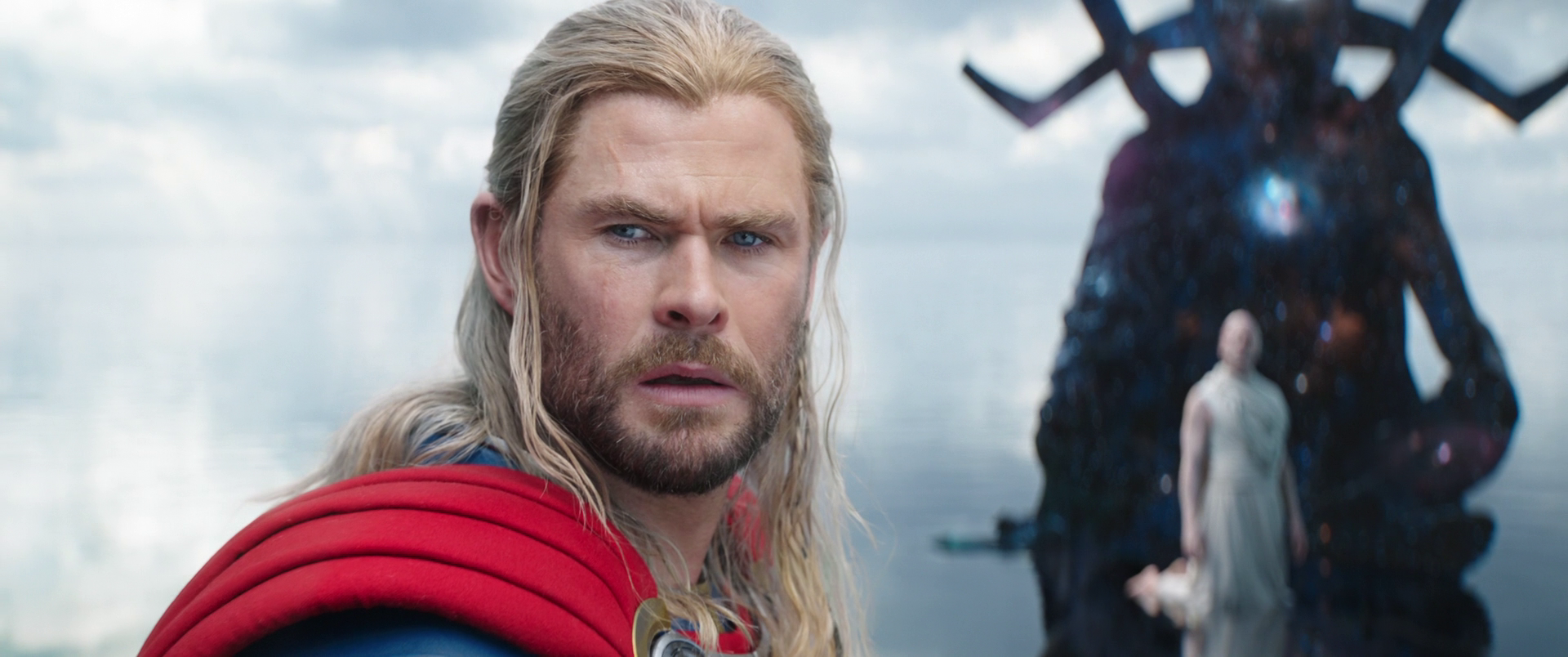 Thor (Chris Hemsworth) turns to a dying Jane Foster (Natalie Portman) while Gorr (Christian Bale) prepares to ask Eternity a wish in Thor: Love and Thunder (2022), Marvel Entertainment via Blu-ray