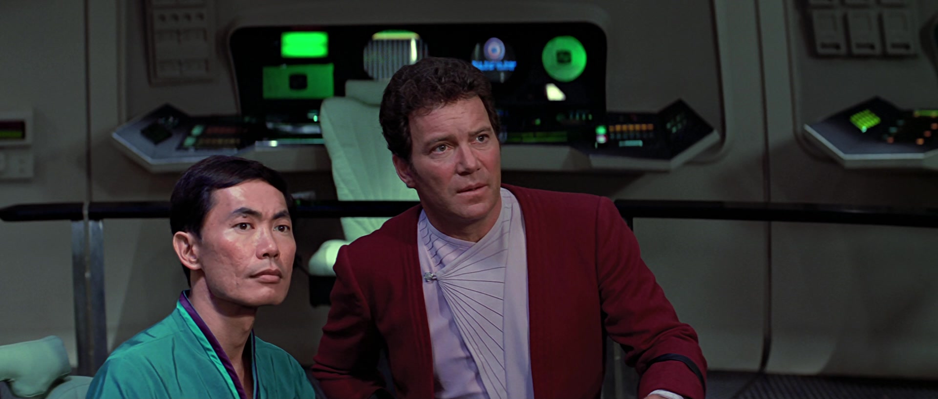 Kirk (William Shatner) and Sulu (George Takei) find themselves in a standoff with the Klingon commander Kruge (Christopher Lloyd) in Star Trek III: The Search for Spock (198), Paramount Pictures