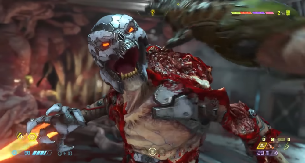 The Doomslayer about to grab the head of a Dread Knight during a Glory Kill via Doom Eternal (2020), Bethesda Softworks