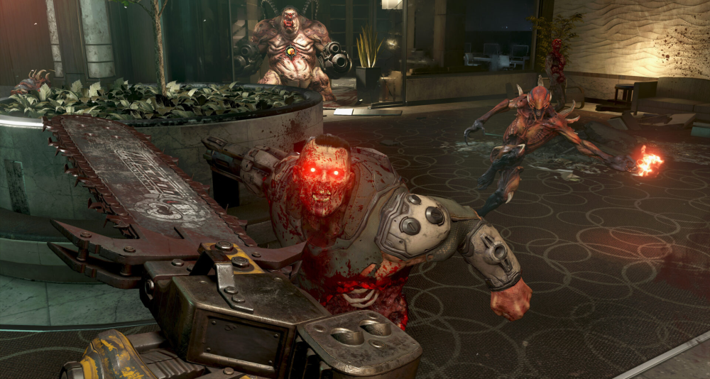 The Doomslayer stands before a soldier, Imp, and Mancubus with Chainsaw in hand via Doom Eternal (2020), Bethesda Softworks