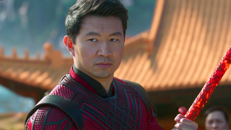 Shang-Chi (Simu Liu) stands ready to defend Tao Lo from the Ten Rings in Shang-Chi and the Legend of the Ten Rings (2021), Marvel Entertainment via Blu-ray