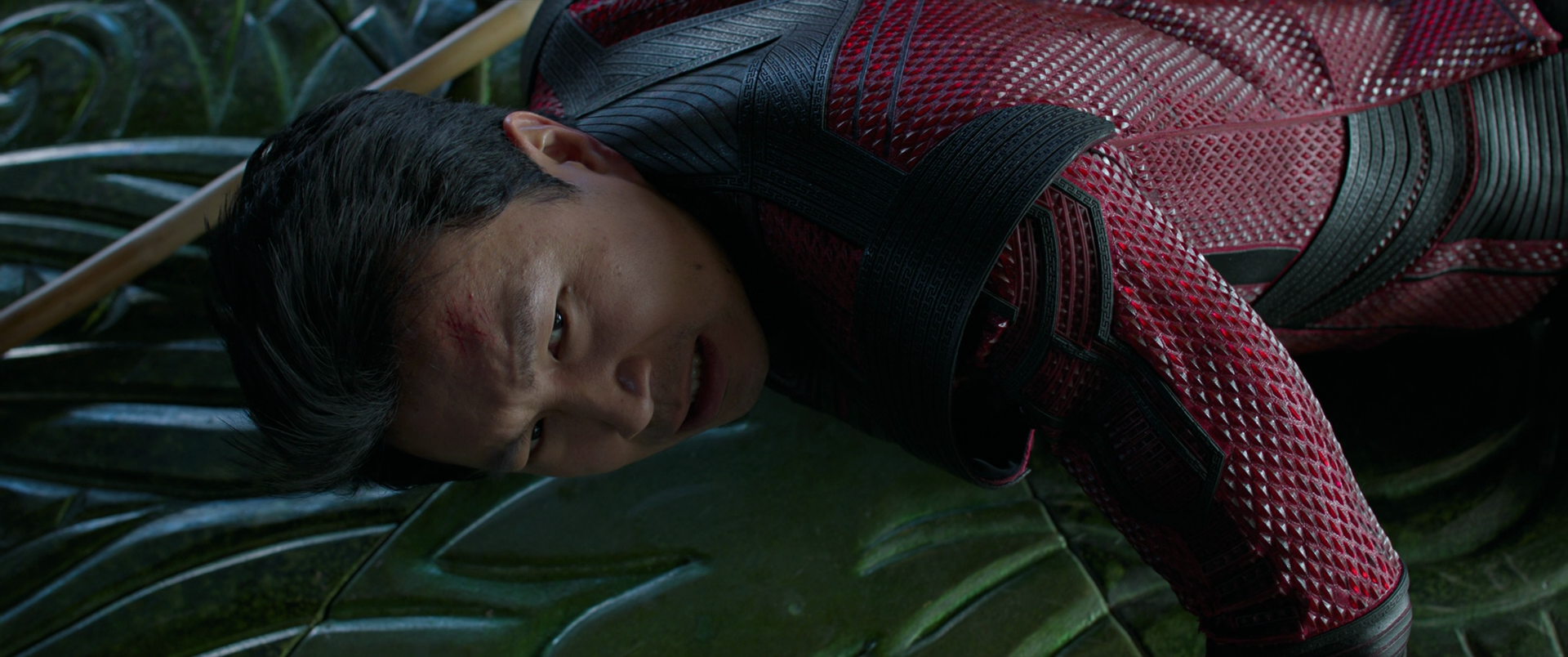 Shang-Chi (Simu Liu) is knocked down by Wenwu (Tony Leung) in Shang-Chi and the Legend of the Ten Rings (2021), Marvel Entertainment via Blu-ray