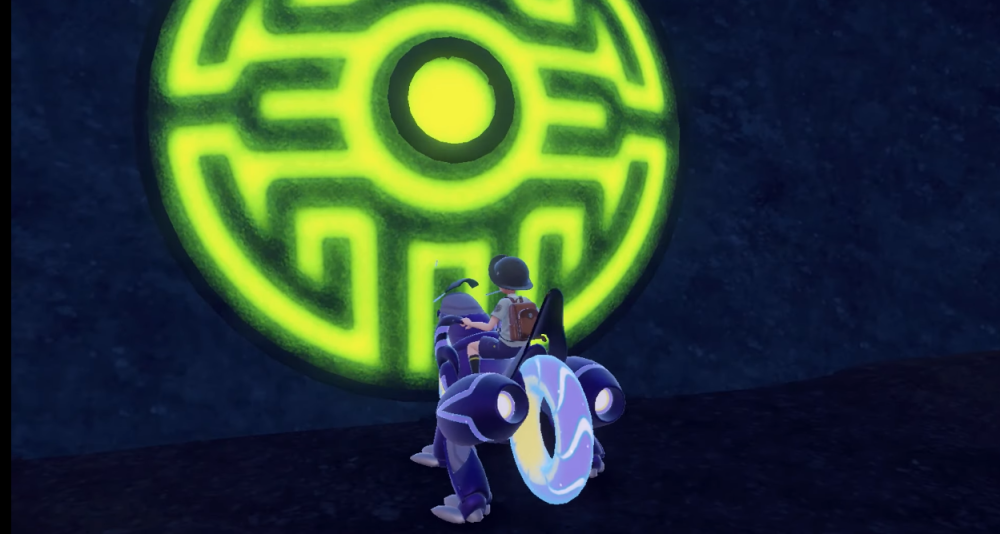 The player stands before the Groundblight Shrine, riding a Miraidon via Pokémon Scarlet & Violet (2022), Nintendo
