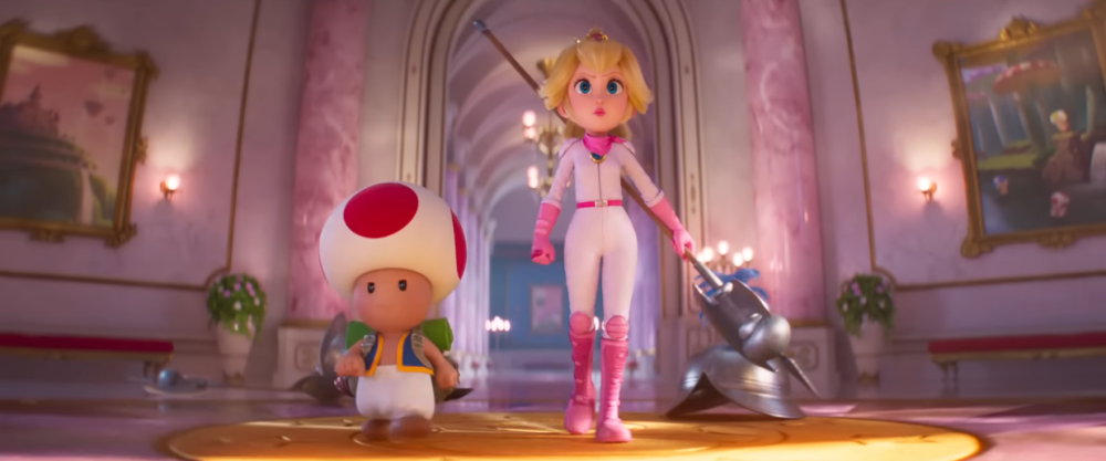 Toad and Peach march into battle, the latter dressed in biker gear and armed with a lance via The Super Mario Bros. Movie (2023), Illumination, Nintendo