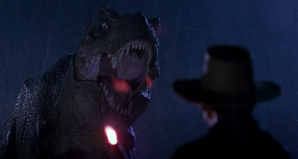 The T-Rex intimidates Dr. Grant (Sam Neill) in 'Jurassic Park' (1993), Universal Pictures
