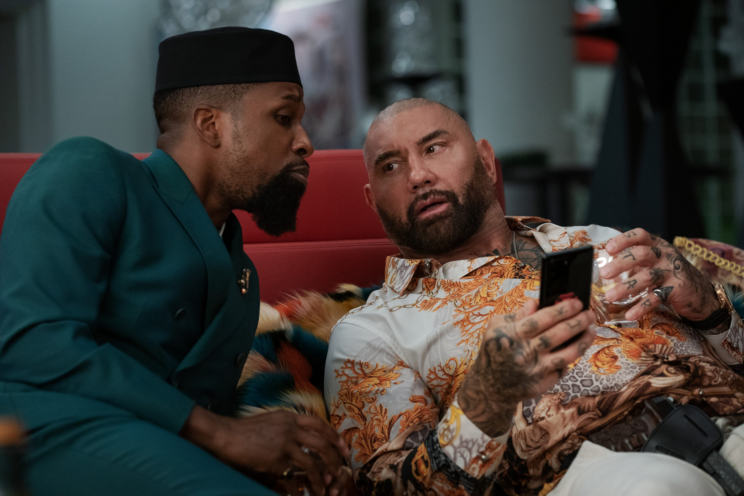 Glass Onion: A Knives Out Mystery (2022). (L-R) Leslie Odom Jr. as Lionel, and Dave Bautista as Duke. Cr. John Wilson/Netflix © 2022.