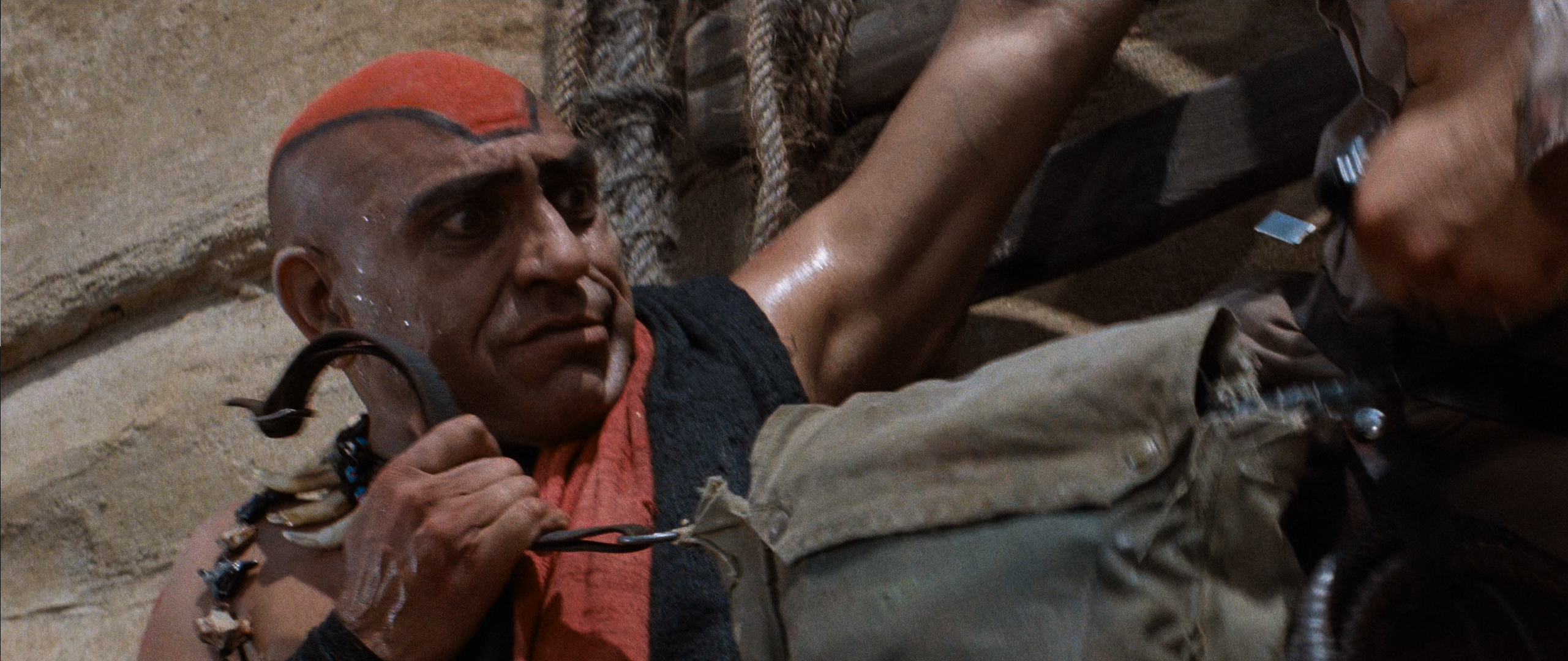 Mola Ram (Amrish Puri) refuses to let go of the shivalinga stones in Indiana Jones and the Temple of Doom (1984), Lucasfilm Ltd. via Blu-ray