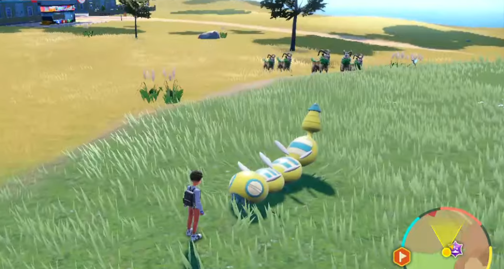 A player stands before their Three-Segment form Dudunsparce, a heard of Gogoat can be seen in the background via Pokémon Scarlet & Violet (2022), Nintendo