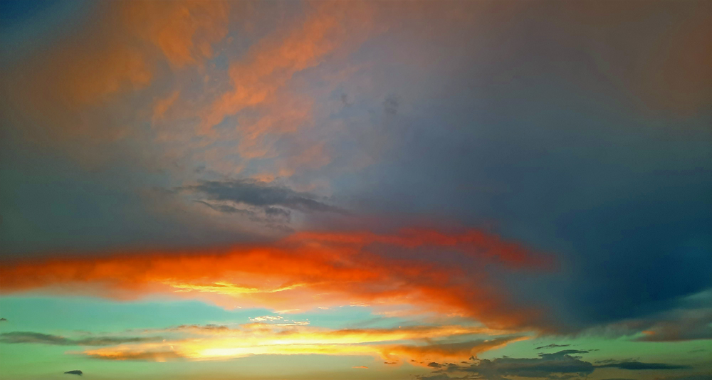Original photo of a colorful, rural, evening sky. Copyright 2022, Paul Hair.