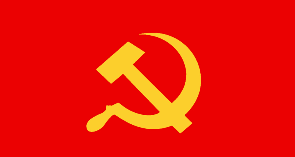 Communist symbol of a yellow hammer and sickle on red background.