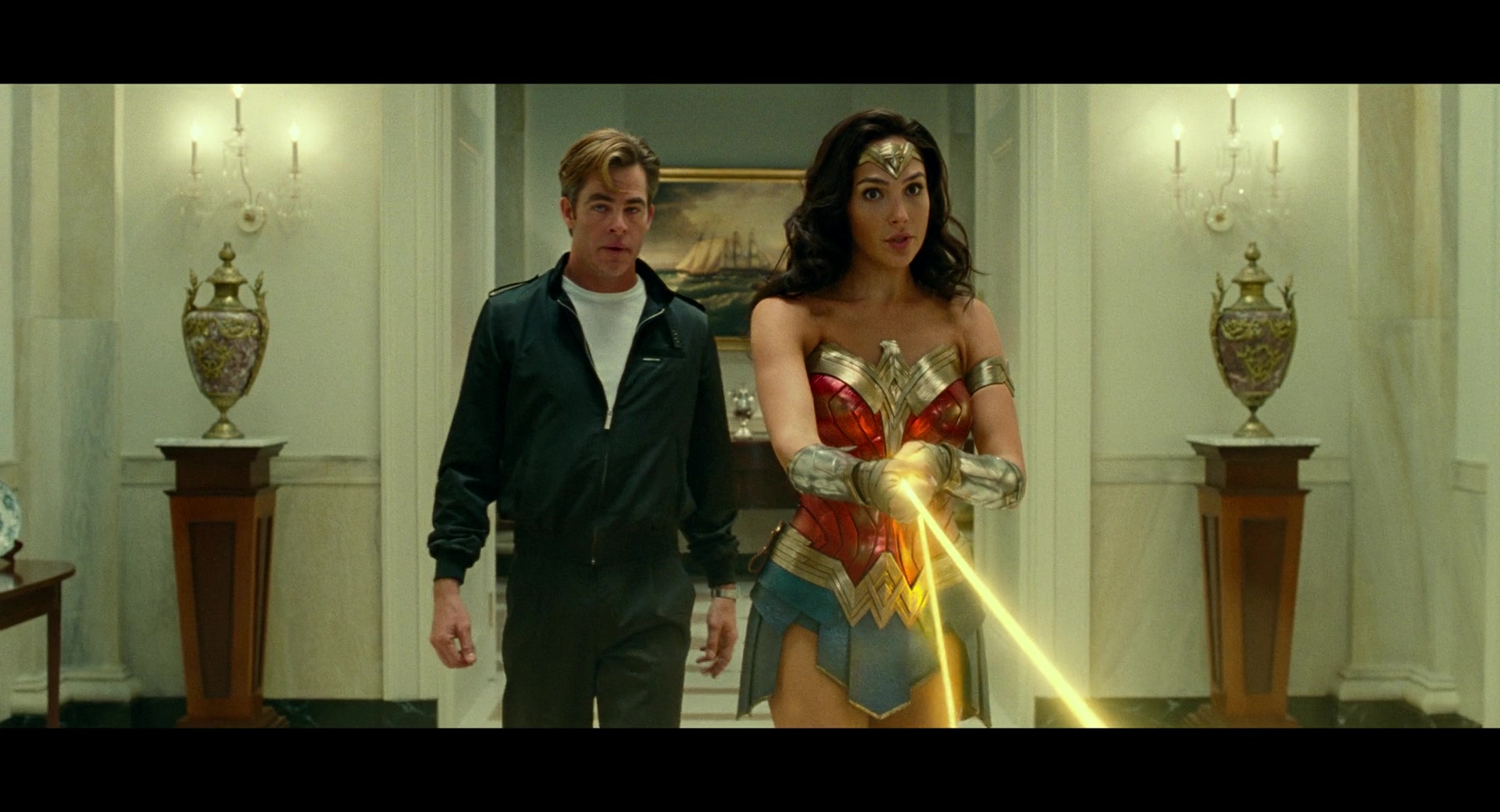Diana (Gal Gadot) and Steve Trevor (Chris Prine) arrive at the White House to stop Maxwell Lord (Pedro Pascal) in Wonder Woman 1984 (2020), Warner Bros. Pictures via Blu-ray