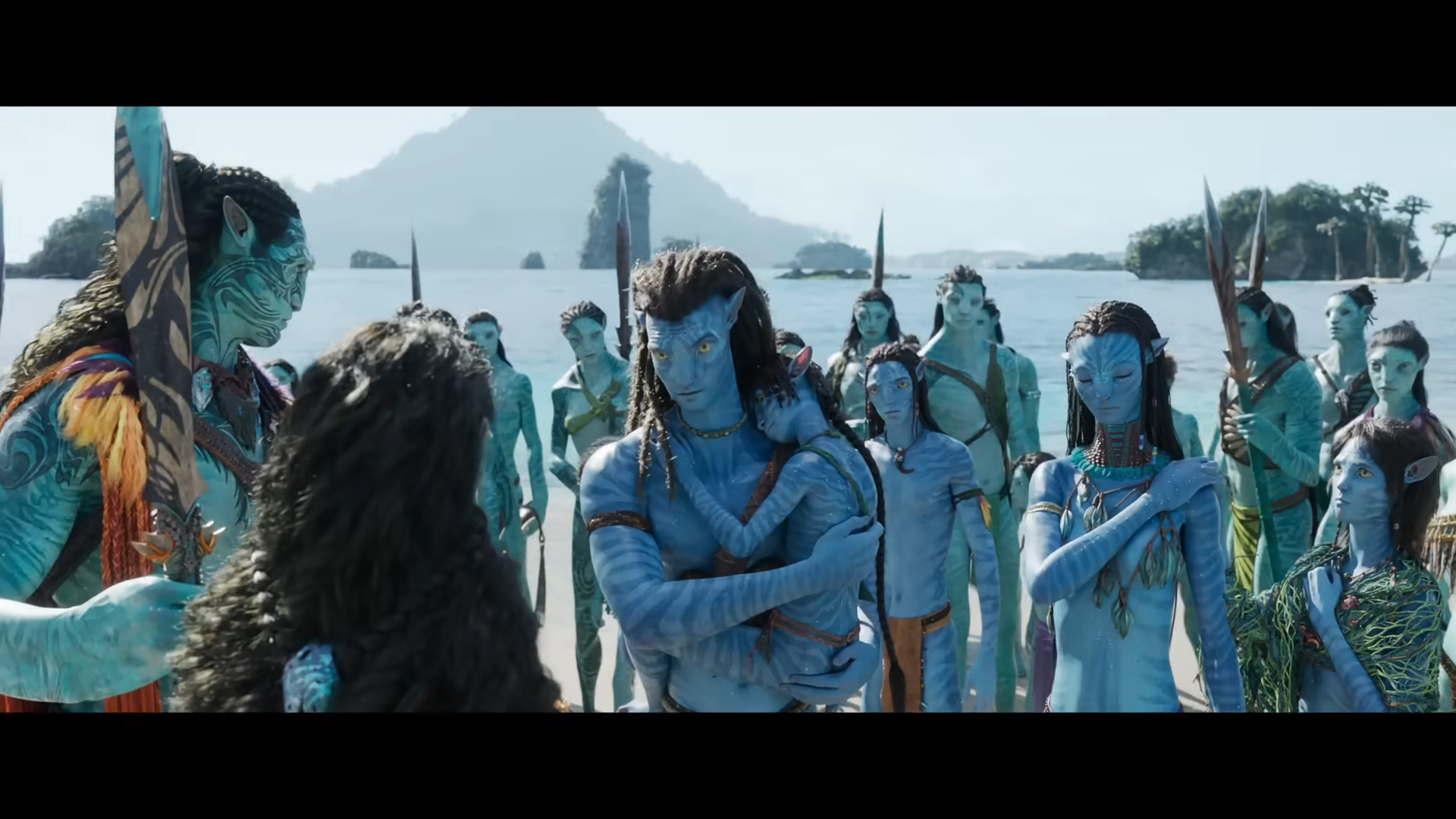 Jake Sully (Sam Worthington) and Neytiri (Zoe Saldaña) introduce themselves and their family to the Metkayina in Avatar: The Way of Water (2022), Disney via YouTube