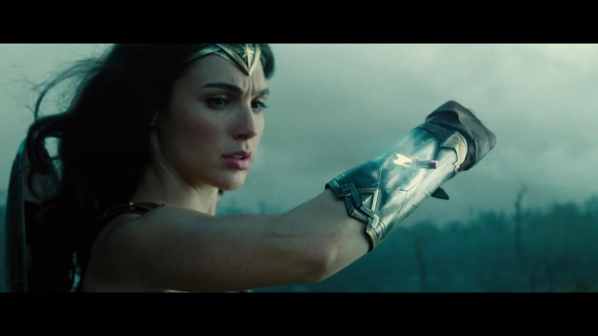 Diana (Gal Gadot) uses her bracers to deflect a bullet in Wonder Woman (2017), Warner Bros, Pictures via Blu-ray