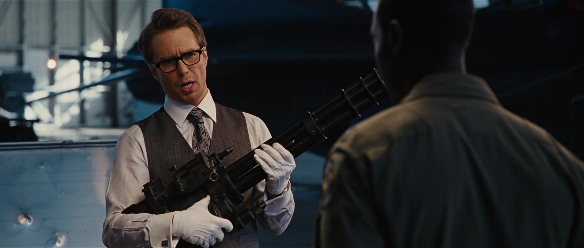 Justin Hammer (Sam Rockwell) offers War Machine (Don Cheadle) an FN F2000 Tactical for his armor in Iron Man 2 (2010), Marvel Entertainment via Blu-ray