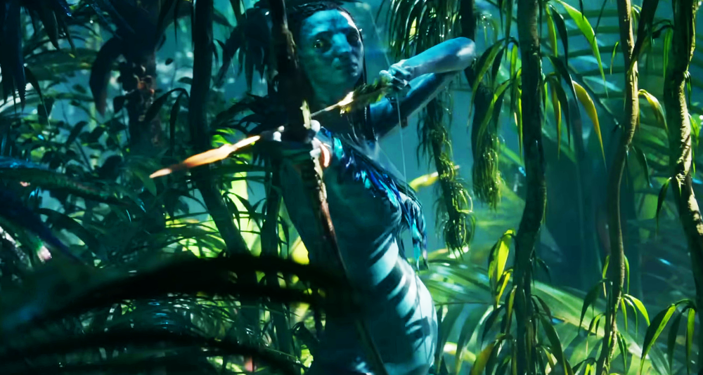 A pregnant Neytitri (Zoe Saldaña) draws her bow in Avatar: The Way of Water (2022), Disney via YouTube
