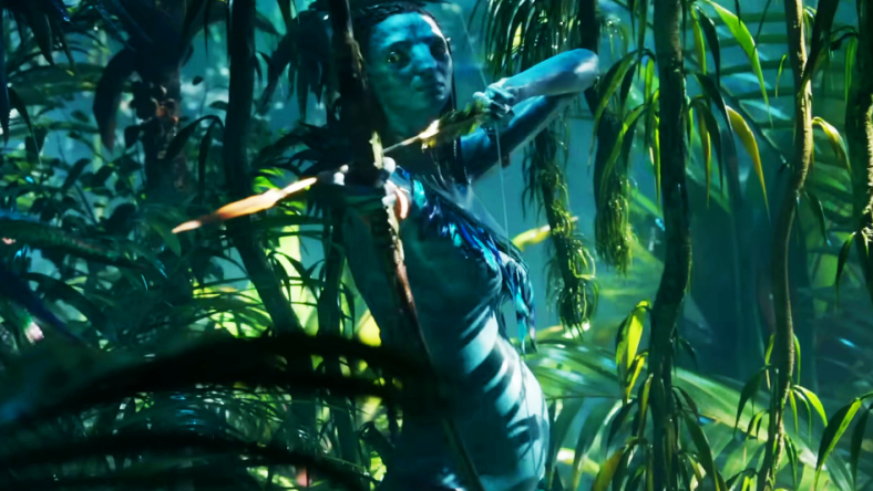 A pregnant Neytitri (Zoe Saldaña) draws her bow in Avatar: The Way of Water (2022), Disney via YouTube