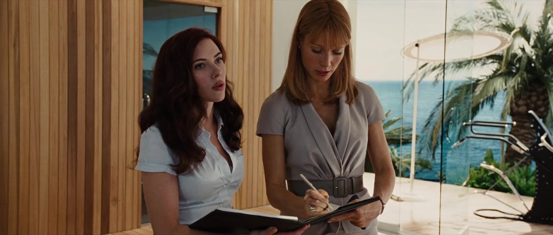 Black Widow (Scarlett Johansson) has some papers for Pepper Potts (Gwenyth Paltrow) in Iron Man 2 (2010), Marvel Entertainment via Blu-ray