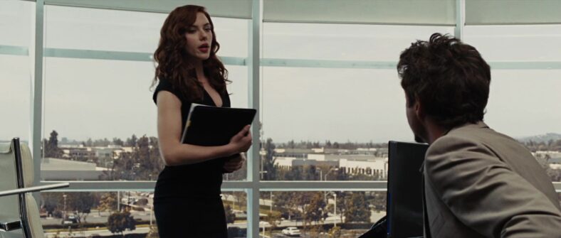 Black Widow (Scarlett Johansson) gives Tony Stark (Robert Downey Jr.) his daily brief in Iron Man 2 (2010), Marvel Entertainment via Blu-ray