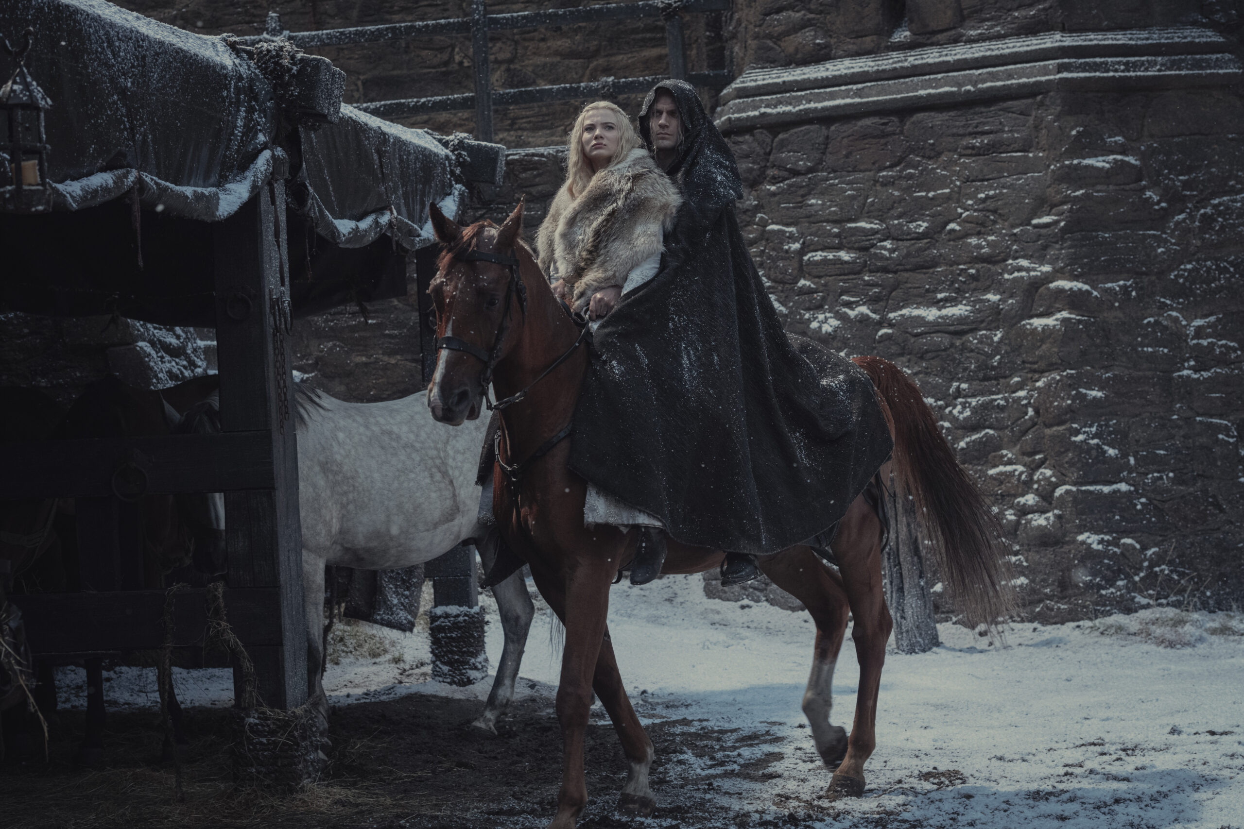 Geralt (Henry Cavill) and Ciri (Freya Allan) arrive in Kaer Morhenin The Witcher Season 2 Episode 2 “Kaer Morhen” (2021) via Netflix
