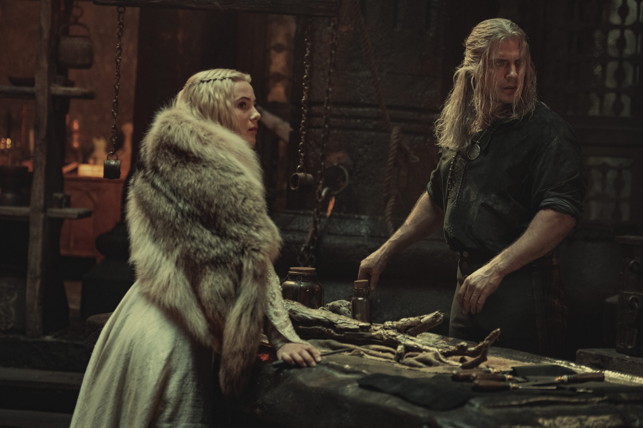 Geralt (Henry Cavill) and Ciri (Ferya Allan) take an inventory of their equipment in The Witcher Season 2 Episode 2 “Kaer Morhen” (2021) via Netflix