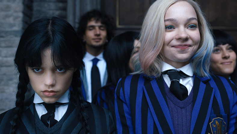 Wednesday. (L to R) Jenna Ortega as Wednesday Addams, Emma Myers as Enid Sinclair in episode 102 of Wednesday. Cr. Courtesy of Netflix © 2022