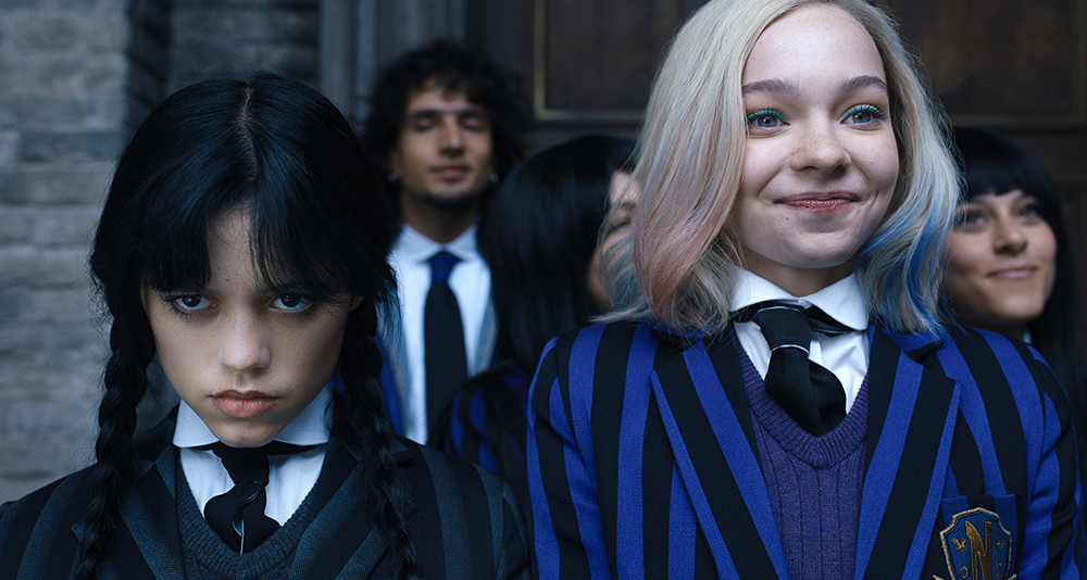 Wednesday. (L to R) Jenna Ortega as Wednesday Addams, Emma Myers as Enid Sinclair in episode 102 of Wednesday. Cr. Courtesy of Netflix © 2022