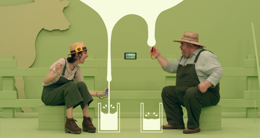 A man and a woman milk a virtual cow via 1-2-Switch (2017), Nintendo