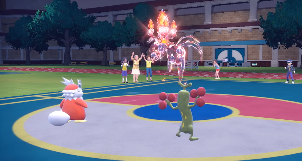 An online player battle sees a Fire Terastallized Hyreigon fending off a Delibird and Shiny Sudowoodo via Pokémon Scarlet & Violet (2022), Nintendo