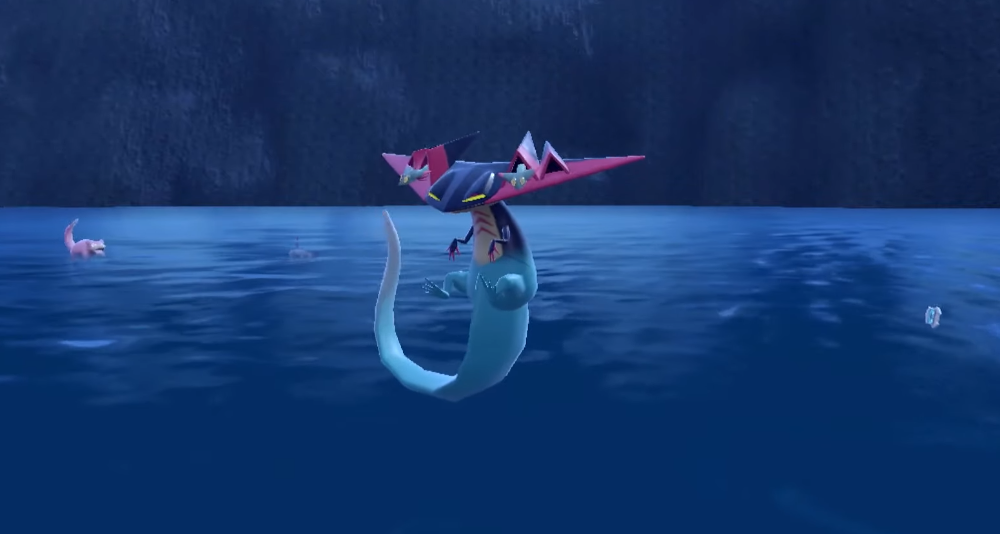 A newly evolved Dragapult floats above the waves. A Slowpoke can be seen in the background via Pokémon Scarlet & Violet (2022), Nintendo