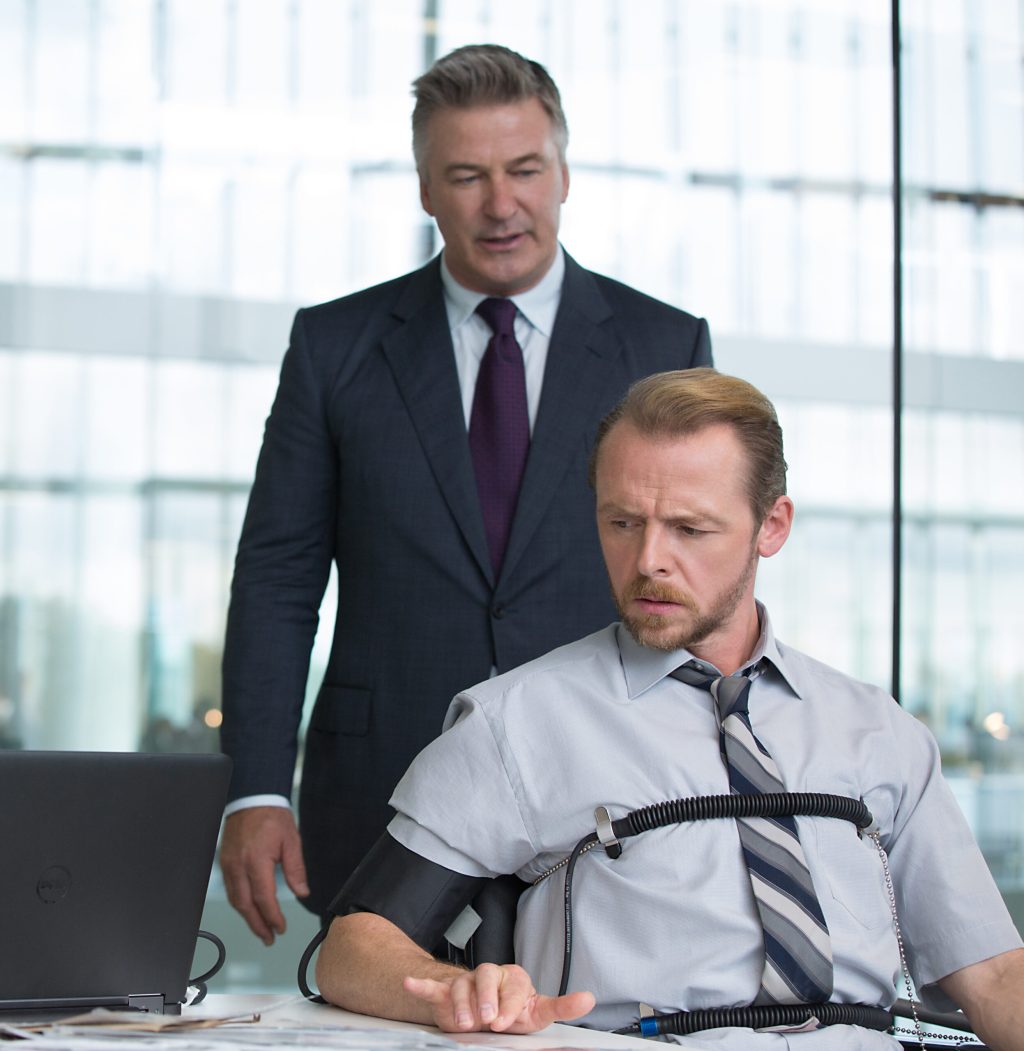 Left to right: Alec Baldwin plays Hunley and Simon Pegg plays Benji in Mission: Impossible - Rogue Nation from Paramount Pictures and Skydance Productions.