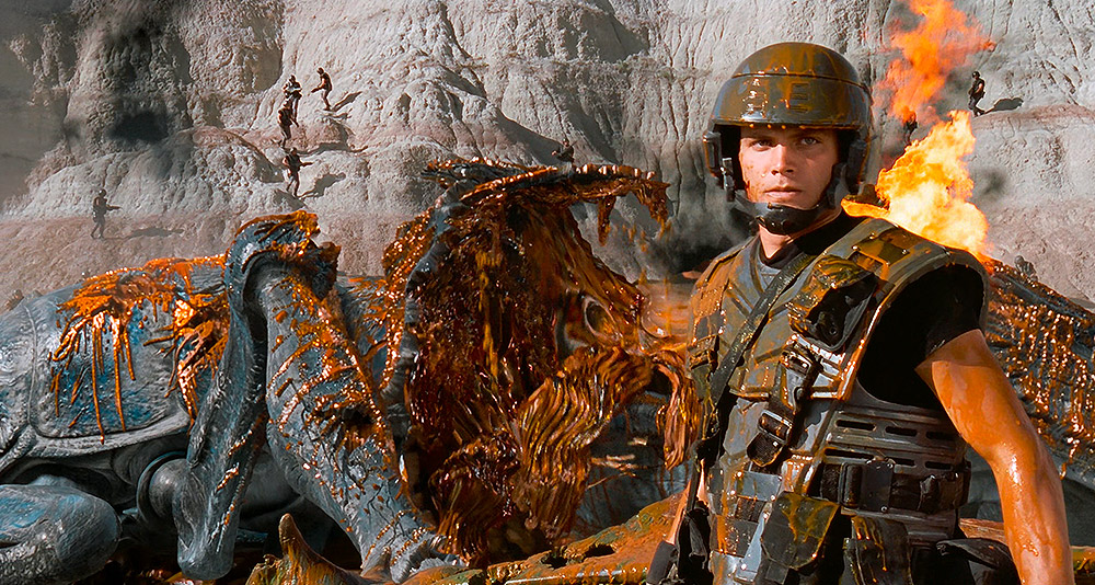 Rico stands over a dead Bug corpse in 'Starship Troopers' (1997), Tri-Star Pictures