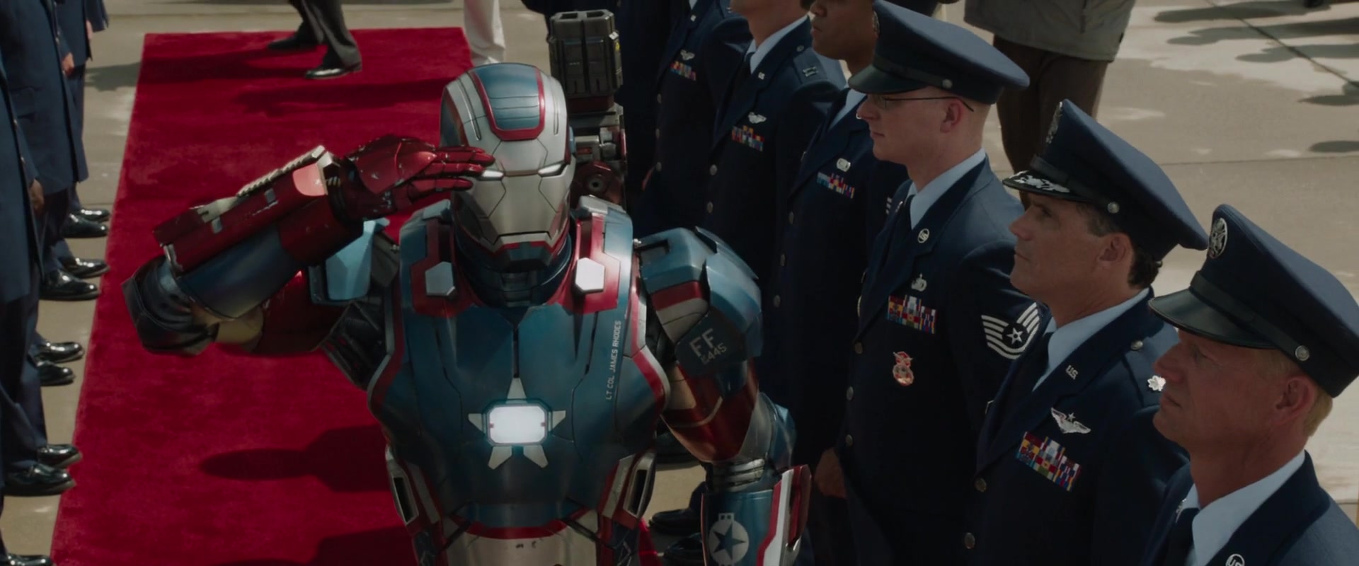 The Iron Patriot (Don Cheadle) greets the President of the United States in Iron Man 3 (2013), Marvel Entertainment