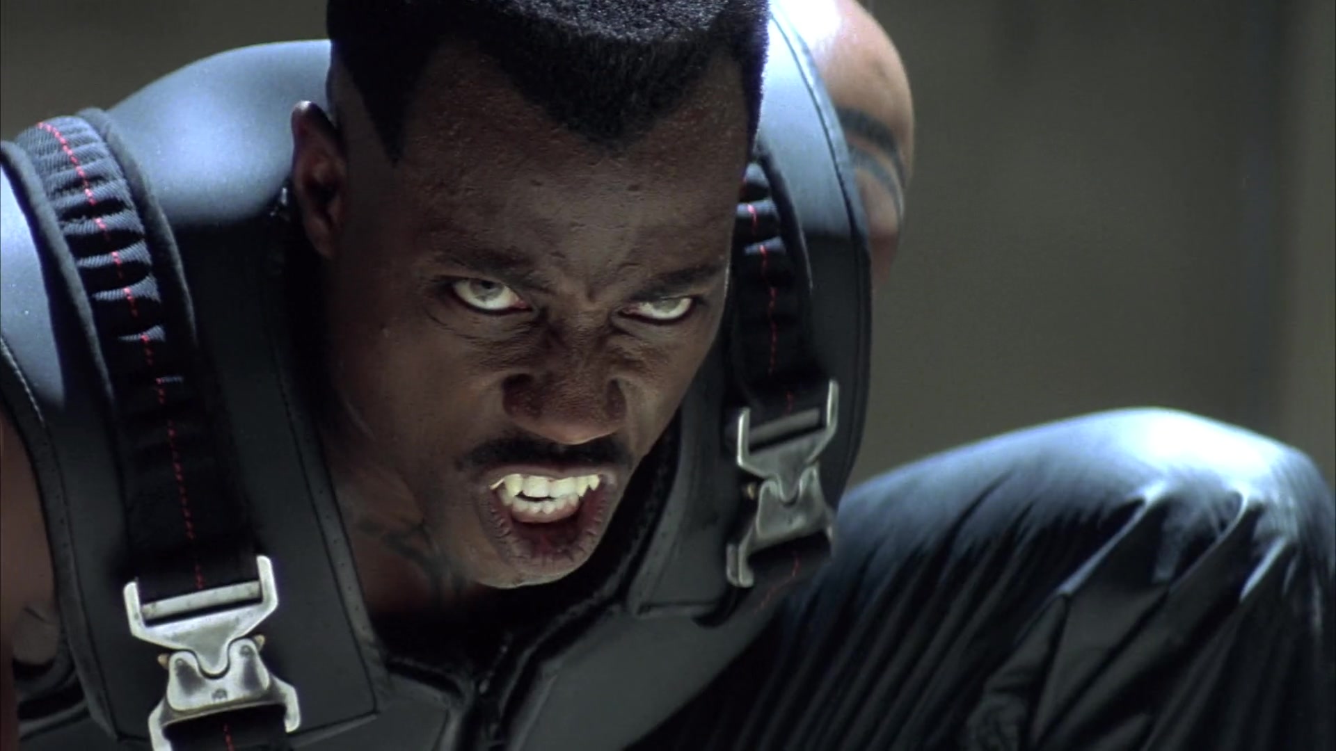 Blade (Wesley Snipes) bares his fangs at Deacon Frost (Stephen Dorff) in Blade (1998), Marvel Entertainment