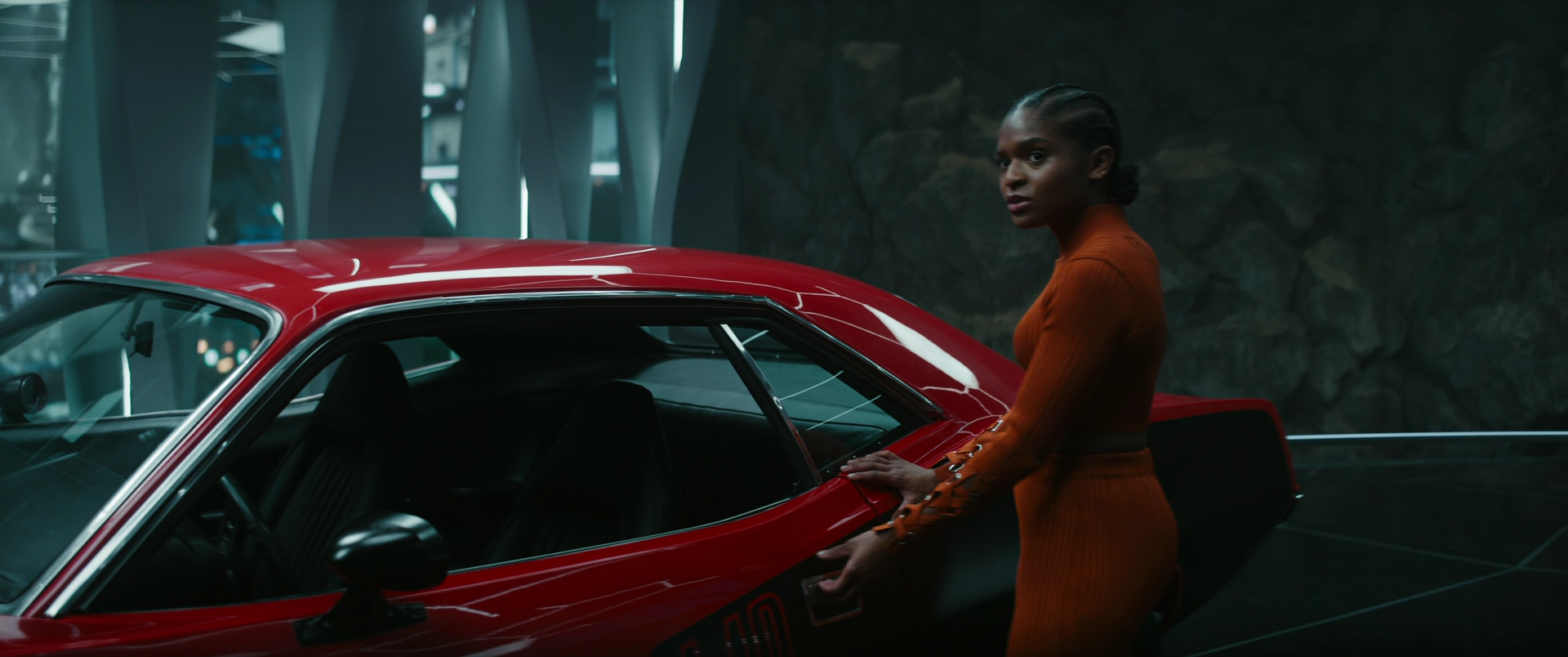 Riri Williams (Dominique Thorne) receives a thank you gift from Shuri (Letitia Wright) in Black Panther: Wakanda Forever (2022), Marvel Entertainment