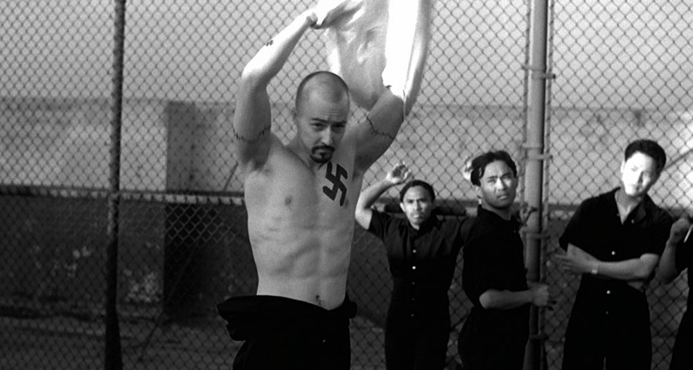 Derek shows off his Nazi tattoos in prison in 'American History X' (1998), New Line Cinema