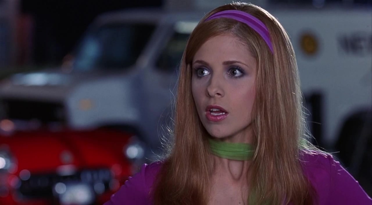 Daphne (Sarah Michelle Gellar) argues with the rest of the Mystery Gang in Scooby-Doo (2002), Warner Bros. Pictures