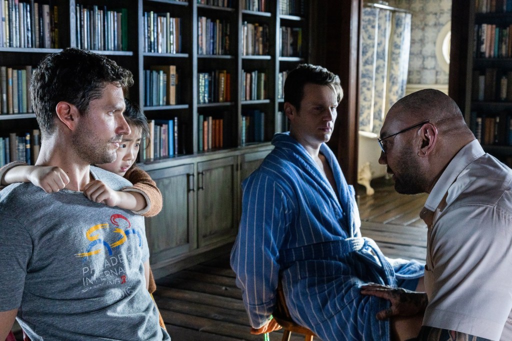 (from left) Andrew (Ben Aldridge), Wen (Kristen Cui), Eric (Jonathan Groff), and Leonard (Dave Bautista) in Knock at the Cabin, directed by M. Night Shyamalan.