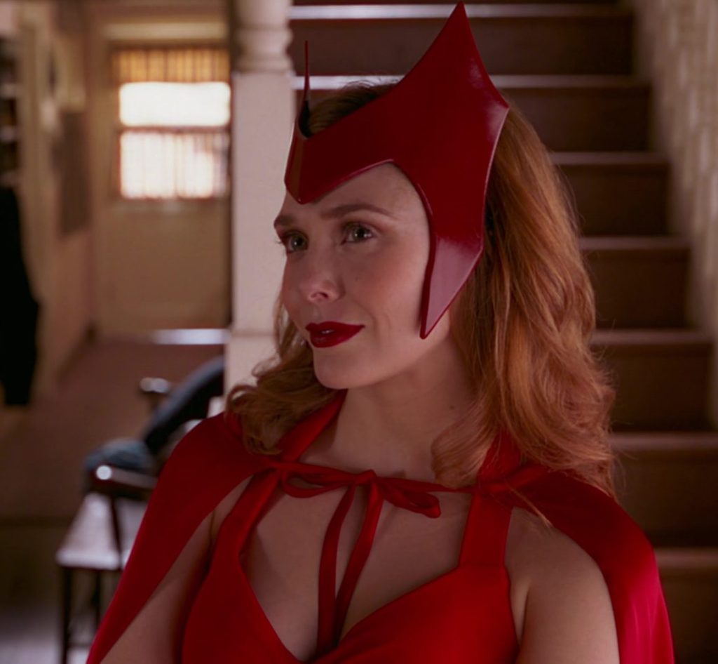 Wanda Maximoff (Elizabeth Olsen) dons her classic comic book costume in WandaVision Season 1 Episode 6 "All-New Halloween Spooktacular!" (2021), Marvel Entertainment