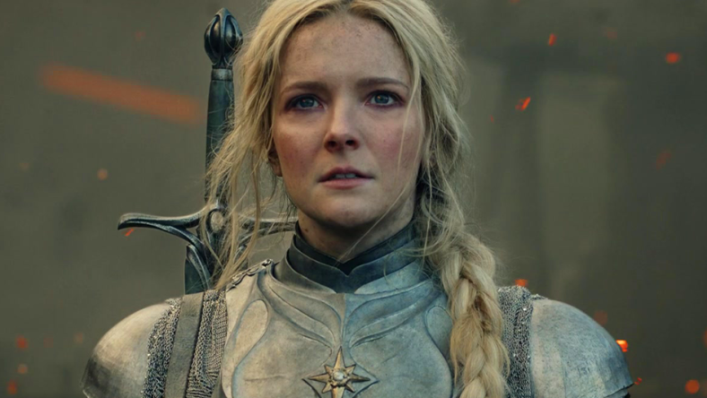 Galadriel (Morfydd Clark) stands alone in the immediate aftermath of the eruption of Mt. Doom in The Lord of the Rings: The Rings of Power Season 1 Episode 6 "Udûn" (2022), Amazon Studios