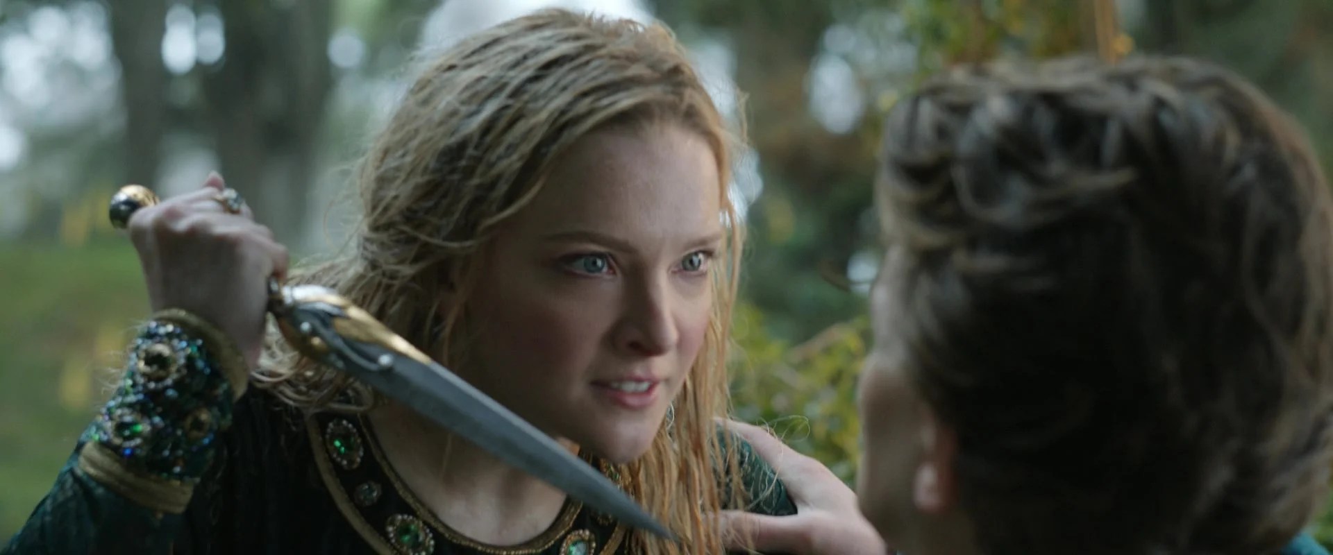 A startled Galadriel (Morfydd Clark) draws her blade on Elrond (Robert Aramayo) in The Lord of the Rings: The Rings of Power Season 1 Episode 8 "Alloyed" (2022), Amazon Studios