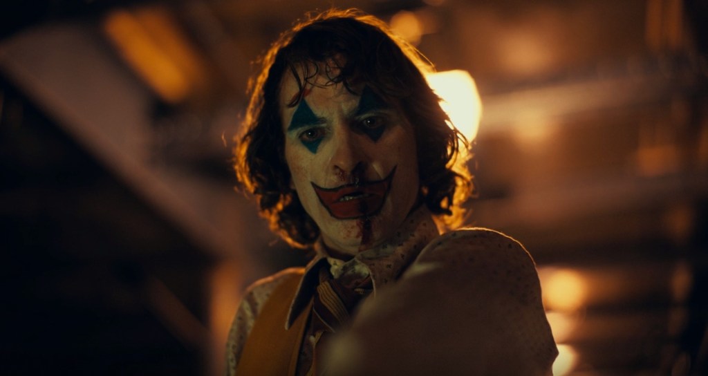 Arthur Fleck (Joaquin Phoenix) kills for the first time in Joker (2019), Warner Bros. Entertainment