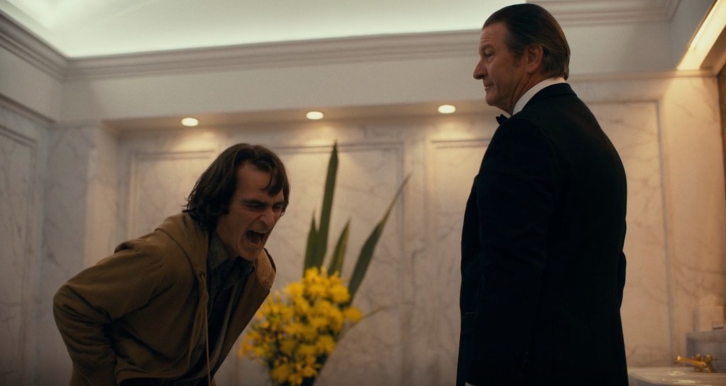 Thomas Wayne (Brett Cullen) tells Arthur Fleck (Joaquin Phoenix) that he isn't his father in Joker (2019), Warner Bros. Entertainment