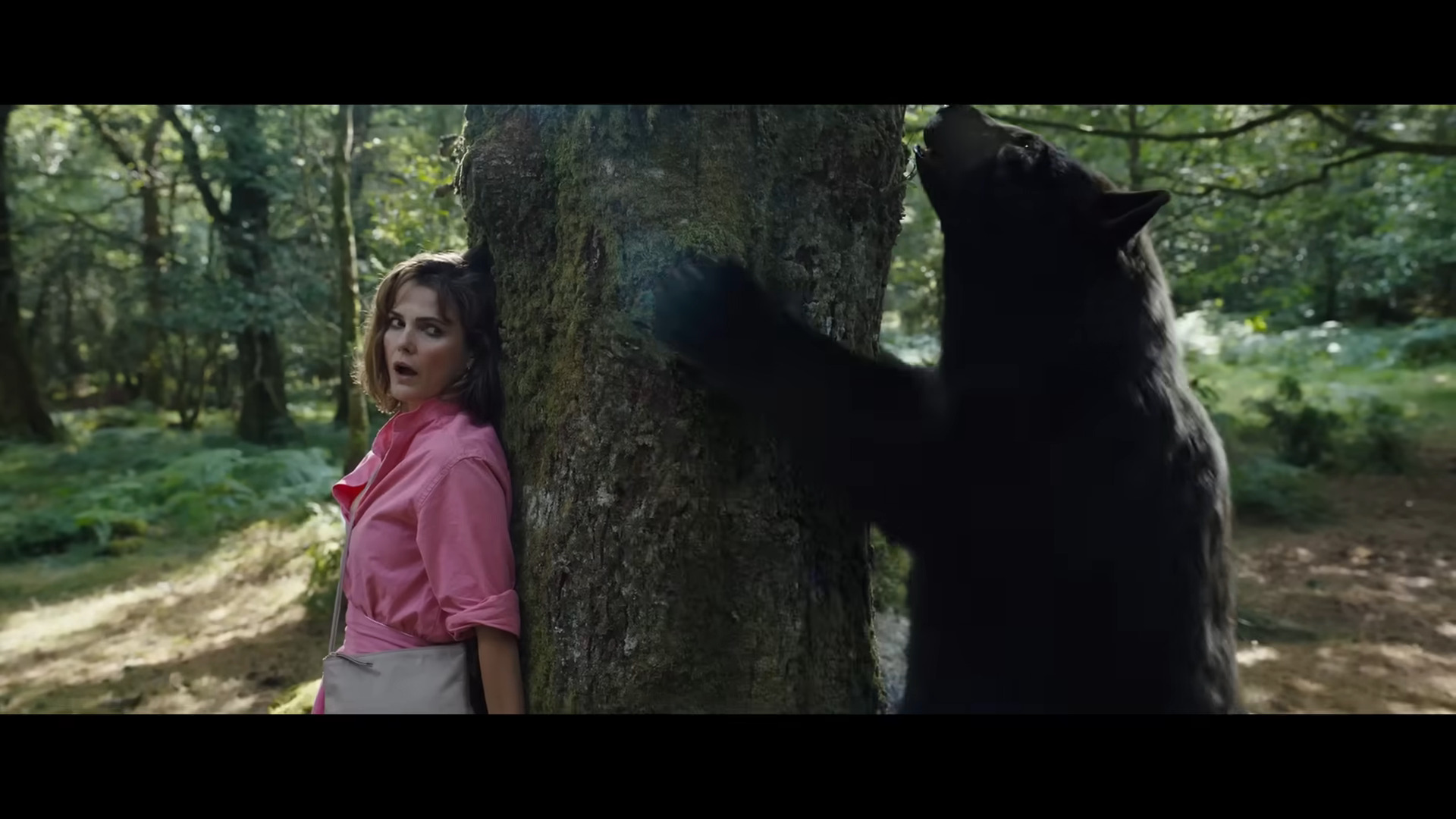 Sari (Keri Russell) attempts to make herself scarce in Cocaine Bear (2023), Universal Pictures