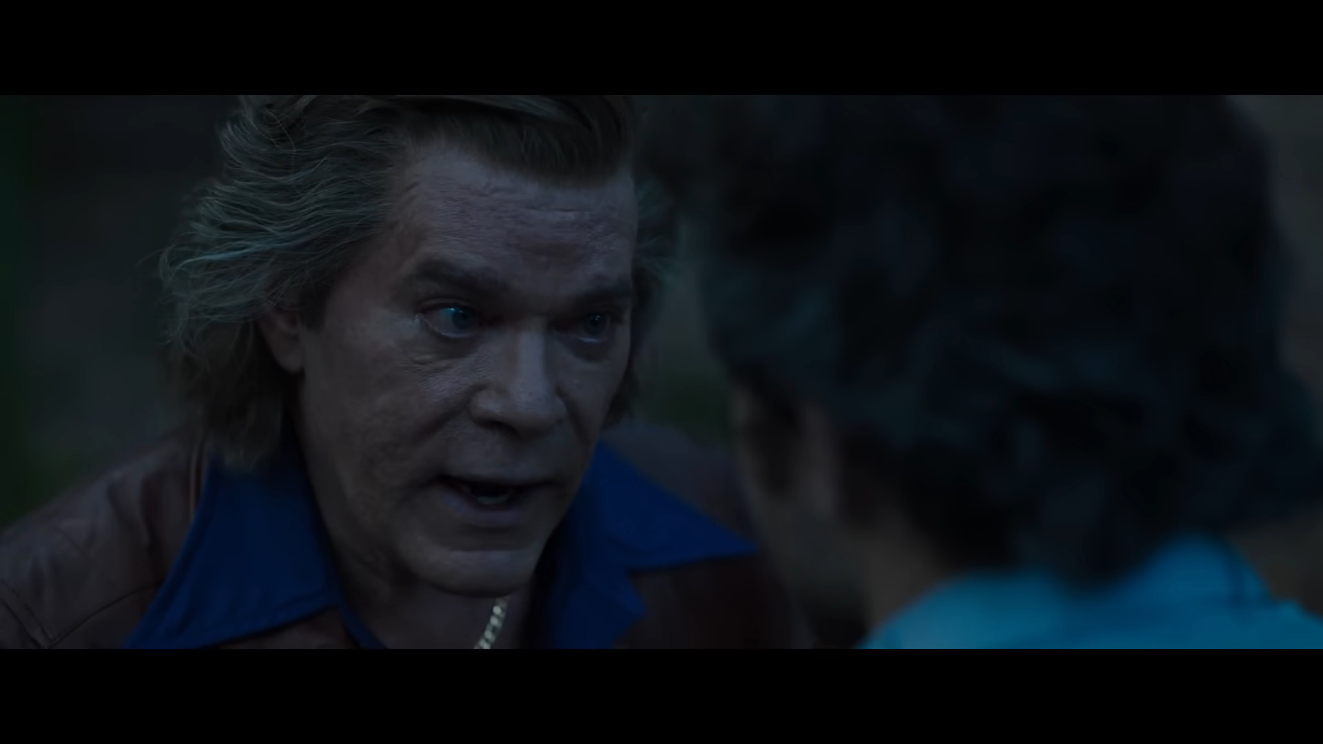 Syd Dentwood (Ray Liotta) orders his son Eddie (Alden Ehrenreich) to retrieve their lost cocaine in Cocaine Bear (2023), Universal Pictures