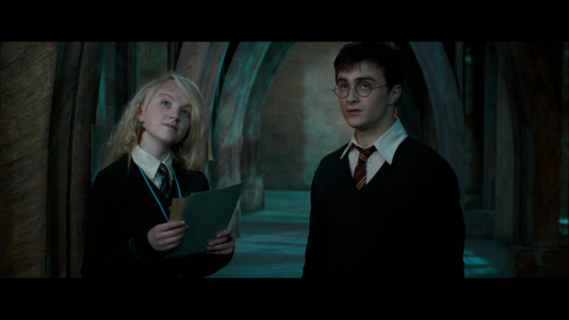 Harry Potter (Daniel Radcliffe) stumbles upon Luna Lovegood (Evanna Lynch) look to the future in Harry Potter and the Order of the Phoenix (2007), Warner Bros. Pictures