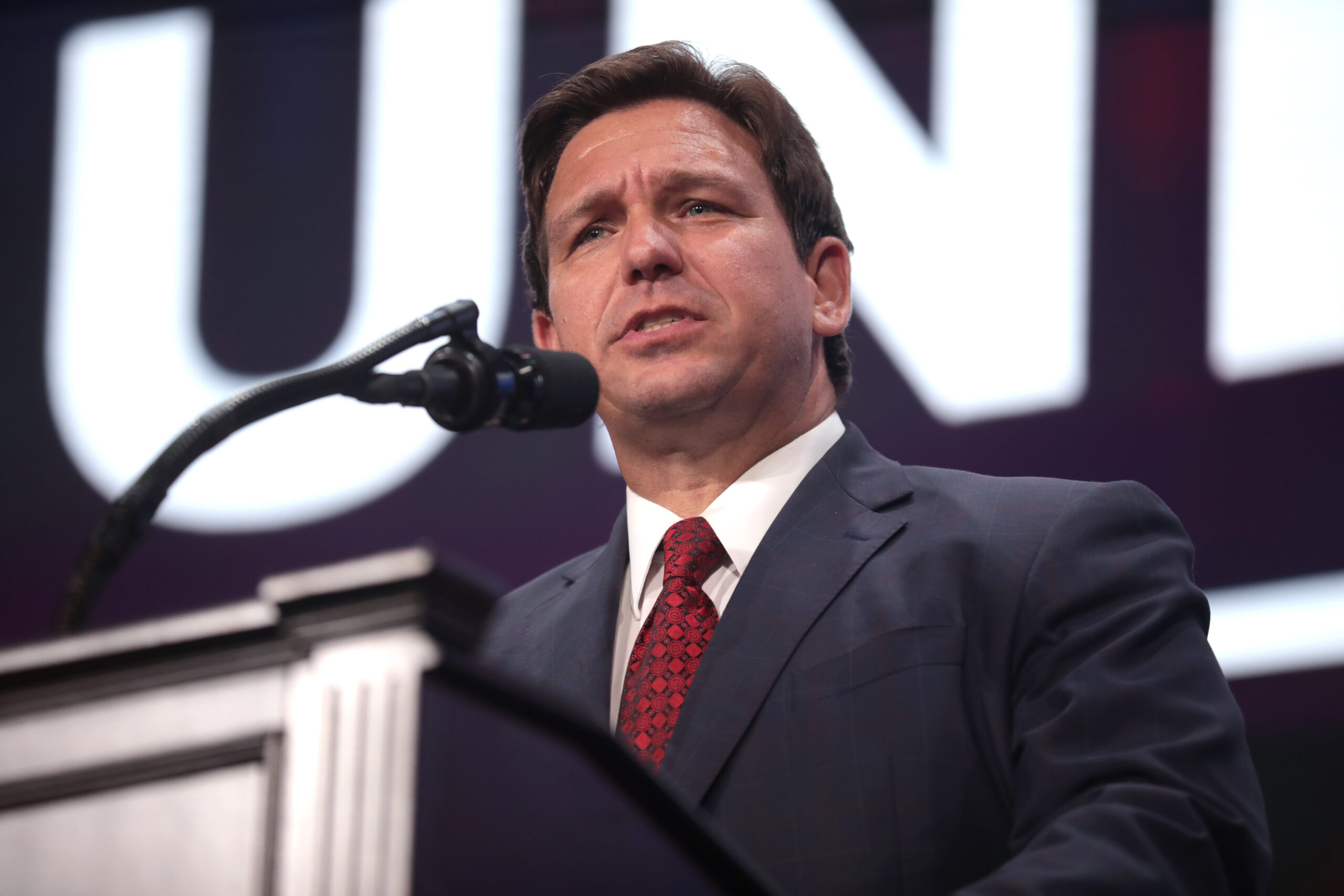 Governor Ron DeSantis speaking with attendees at a "Unite & Win Rally" at Arizona Financial Theatre in Phoenix, Arizona.