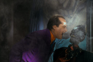 The Joker laughs at the corpse of a mob boss in 'Batman' (1989), Warner Bros. Pictures