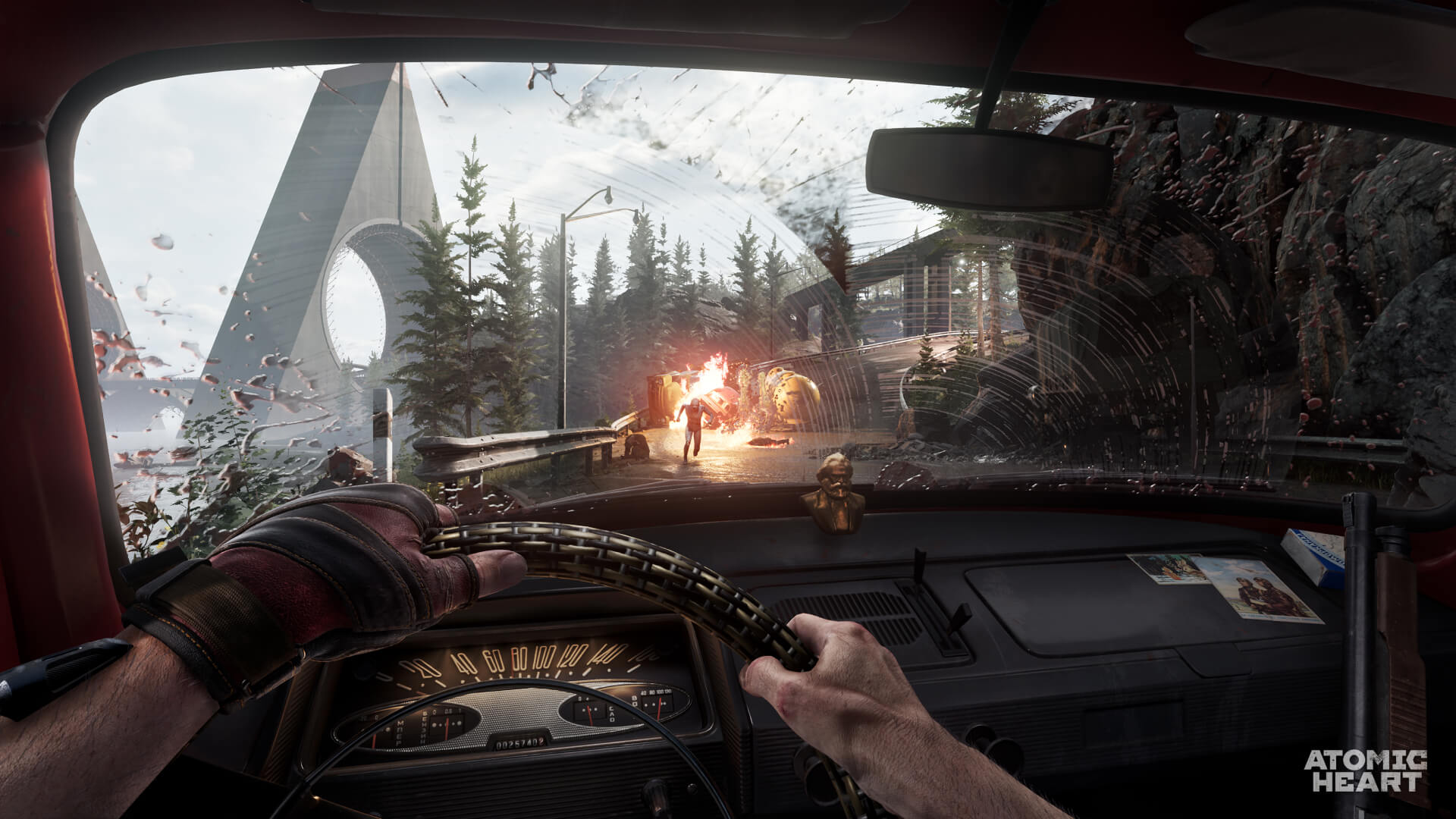 The player drives a car towards a fire and a Lab Tech running straight at them via Atomic Heart (2023), Focus Entertainment