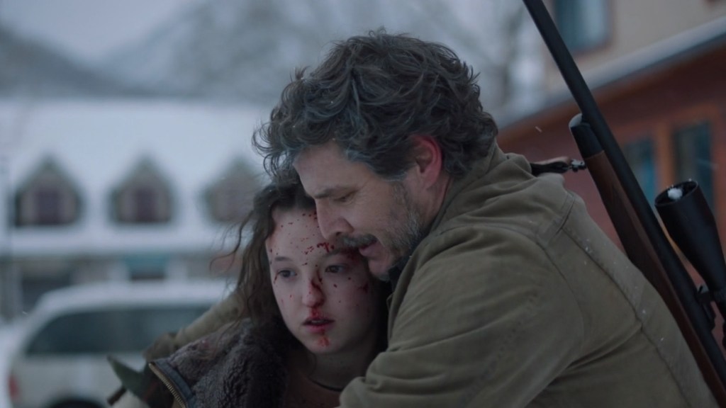 Joel (Pedro Pascal) comforts Ellie (Bella Ramsey) after she brutally murdered David (Stephen Shepherd) in The Last of Us Season 1 Episode 8 'When We Are In Need' (2023), HBO Max
