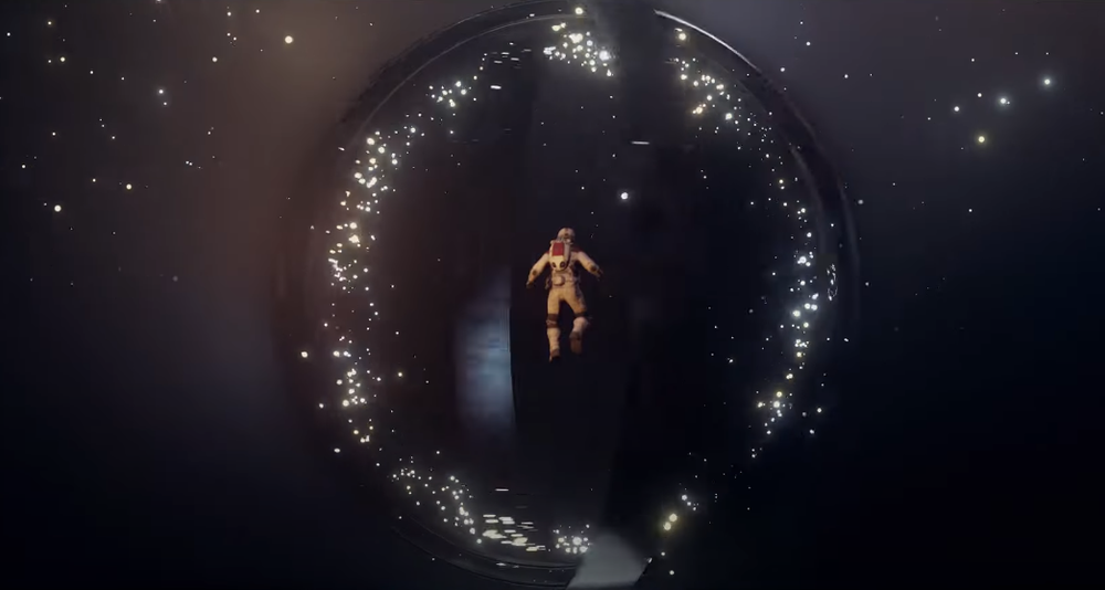 An astronaut floats before a whirling alien artifact made of rings via Starfield: Official Launch Date Announcement, Bethesda Softworks YouTube